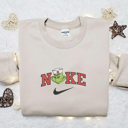 The Villian Grinch Nurse x Nike Christmas Embroidered Sweatshirt Movie Merry Christmas Embroidered Shirt Best Christmas Day Gift Ideas